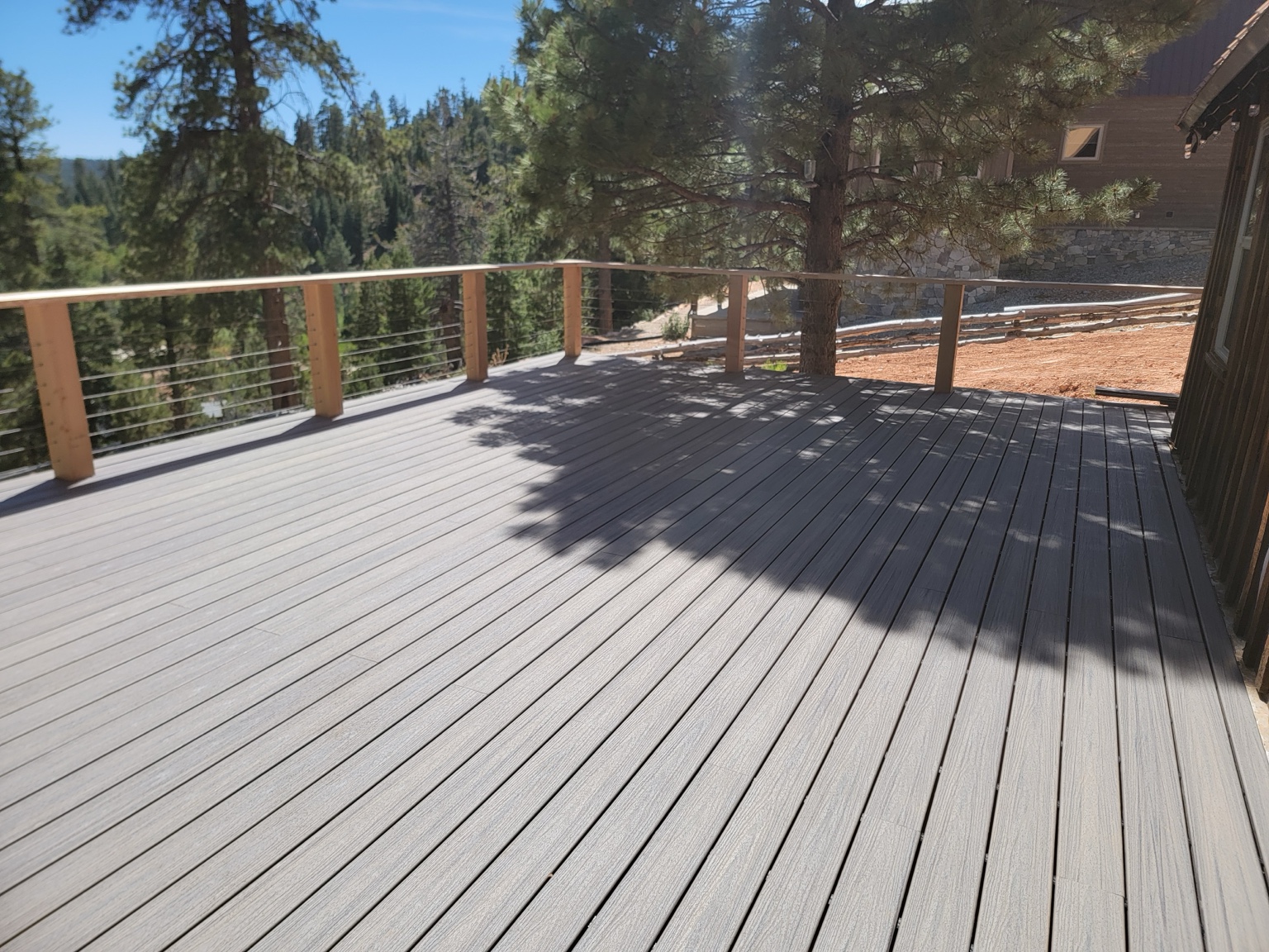 New gray deck boards and cable railing