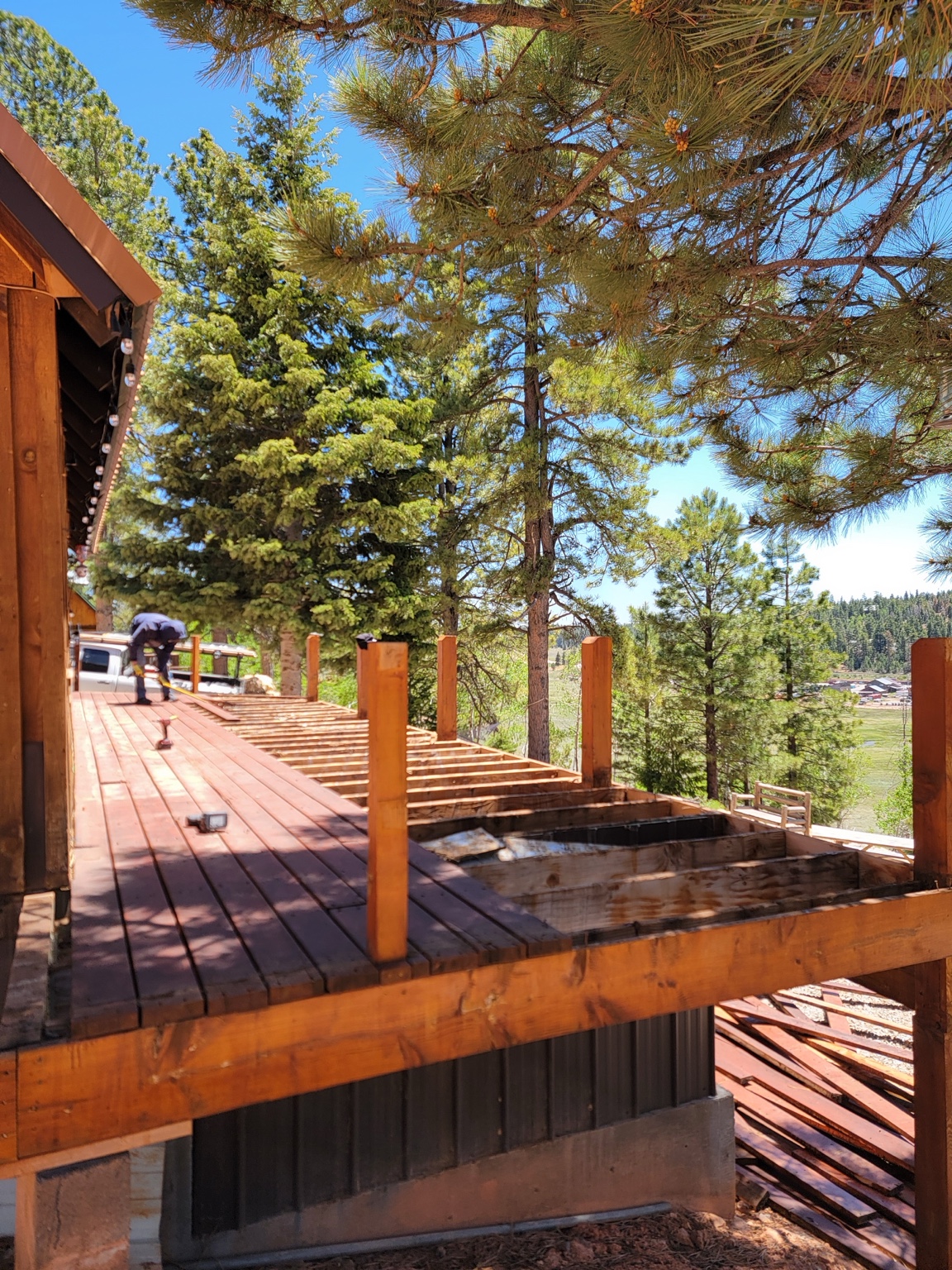 Deck renovation with old boards removed and framing exposed