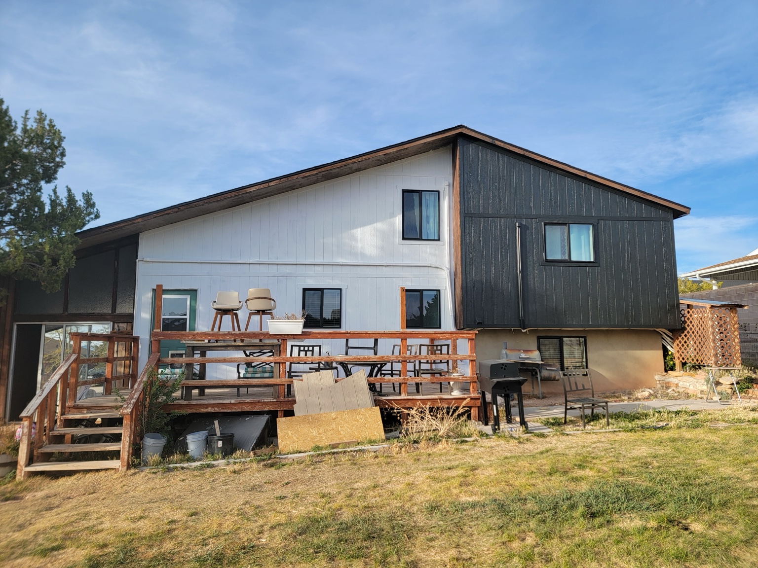 Updated rear siding in white and charcoal