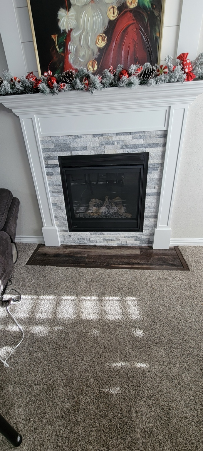 Stone-look fireplace surround with white mantel