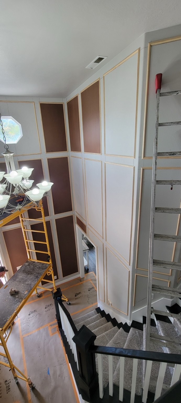 Decorative wall molding during installation in a stairwell